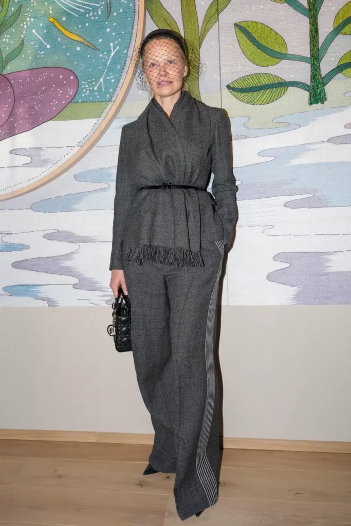Model and actor Pamela Anderson, 57, wore a slate grey suit